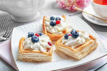 Plate with delicious pastries, closeup