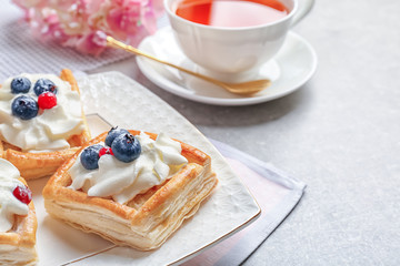 Plate with delicious pastries, closeup