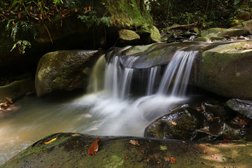 Fototapeta na wymiar Tropical rainforest waterfall in Sabah Borneo, Malaysia