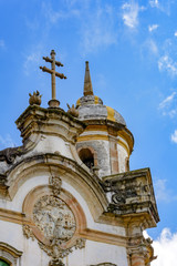 Fototapeta na wymiar Tower and facade of the ancient church of St. Francis of Assisi built in the year 1771 in Baroque style in the city of Ouro Preto in Minas Gerais