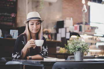 Portrait of young business woman drinking coffee. business woman lunch in cafe during her work break.