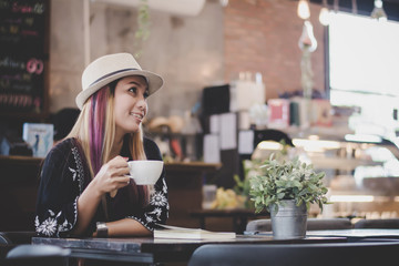 Portrait of young business woman drinking coffee. business woman lunch in cafe during her work break.