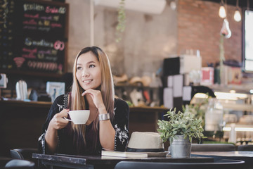 Portrait of young business woman drinking coffee. business woman lunch in cafe during her work break.