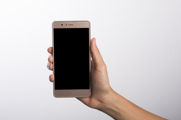 Close Up of a woman holding on mobile phone isolated on white background.