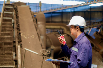 Engineer working in the production line process plant, industrial concept
