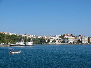 Fototapeta na wymiar The coast of the Greek city of Chalcis on a summer day