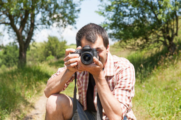 Man photograph with camera in hand