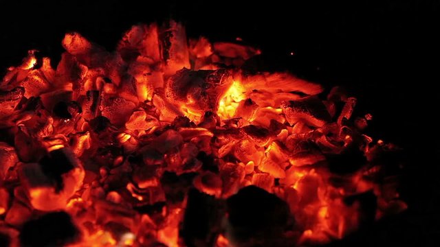 Burning coals in the evening darkness on the island of Mallorca.
