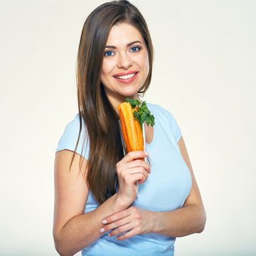 Beautiful smiling  woman holding glass with carrot.