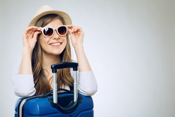Smiling woman wearing sun glasses and hat