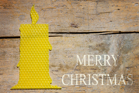 beeswax, candle on wooden table, merry christmas