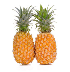Two fresh pineapples isolated on white background