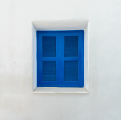 Blue window on Mallorca mediterranean white wall