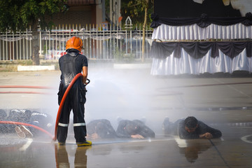 Fireman. Firefighters fighting fire during training.