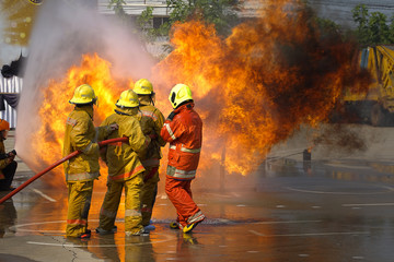 Fireman. Firefighters fighting fire during training.