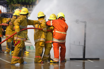 Fireman. Firefighters fighting fire during training.