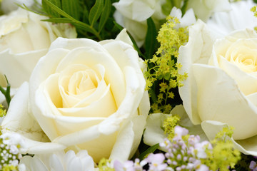 bunch of flowers with white roses