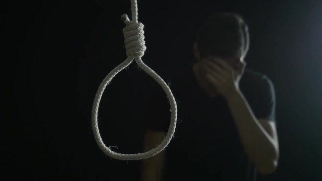 The man wants to hang himself. The guy is depressed and wants to do suicide.