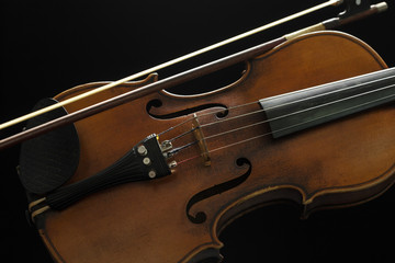 Fototapeta premium Old violin on a black background