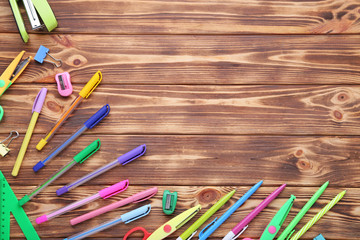 School supplies on brown wooden table