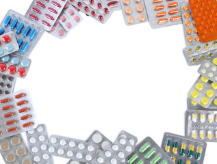 Different pills in blister pack on white background