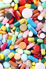 Fototapeta na wymiar Different colorful pills background