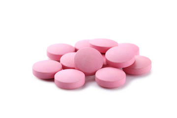 Obraz na płótnie Canvas Pink pills isolated on a white background