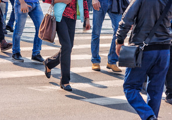 crossroad with walking pedestrians