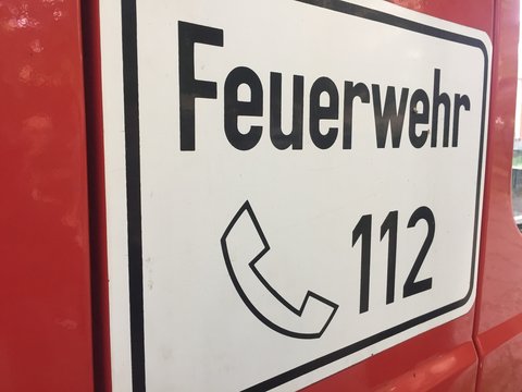 Berlin, Germany - May 12, 2017: Fire Department emergency number sign. 112 is the single European emergency number that can be dialed free of charge is used for fire and medical emergency