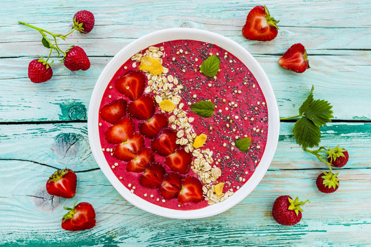 A Bowl Of Healthy And Delicious Strawberry Smoothie With Grains And Fresh Fruit.
