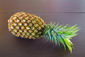Pineapple on a wooden background