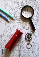 old military topographical map, pencil, flashlight, magnifier and compass