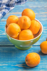 Bowl full of fresh apricots.