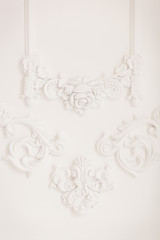Luxury white wall design bas-relief with stucco mouldings roccoco element. Elements of torsel ornament for use as a texture or background