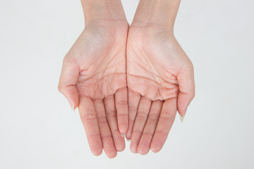 Fototapeta premium two empty female teen hands pleading, isolated on white