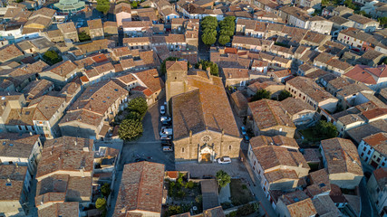 Aerial top view of Bram medieval village architecture and roofs from above, Southern France
