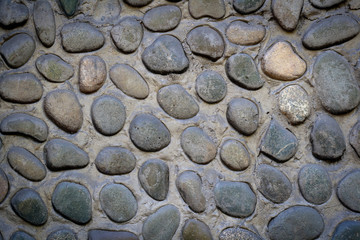 Wall from pebble background