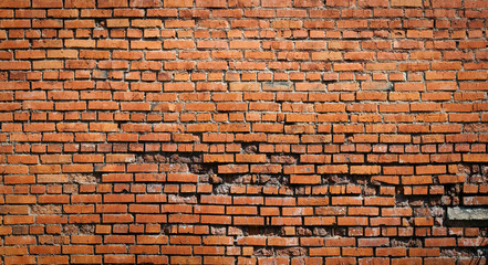 destroyed wall red brick background