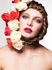 Gorgeous Woman with flowers arround her head in studio photo. Beauty and fashion. Glamour and summer