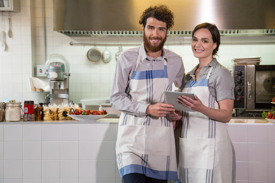 Proud business owners in their restaurant