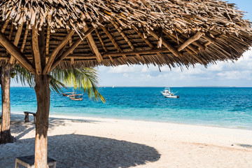 Fototapeta na wymiar beautiful colorful view of blue ocean from beach with straw umbrella