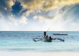 beautiful colorful seascape with fishing boats and fishermen, Zanzibar