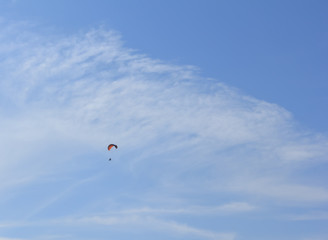 Fototapeta na wymiar People play glider in the sky