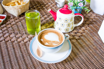 Coffee cup with milk on the table