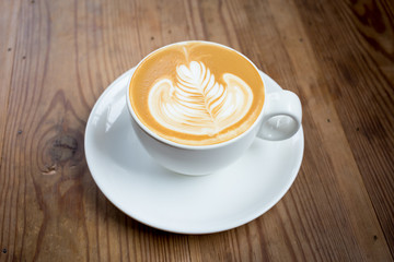 Coffee cup with milk on the table