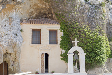 Fototapeta na wymiar Male monastery of Panagia Faneromeni built inside a cave in Crete, Greece
