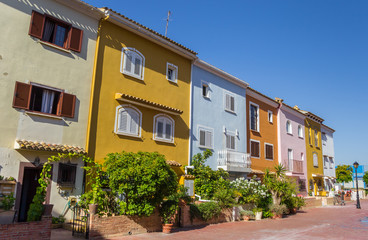 Fototapeta na wymiar Colorful houses of Port Saplaya in Valencia