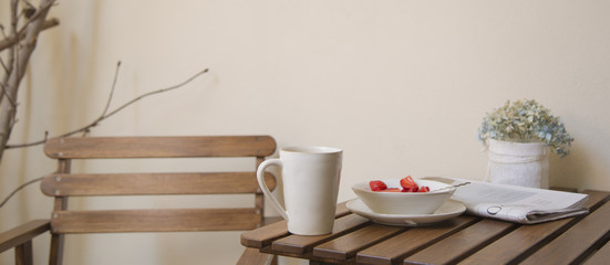Breakfast table in wood and pastel tones