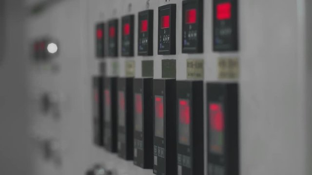 Manufacture of heat-insulating material for pipes, view of the control instrument panel and machine switches.
