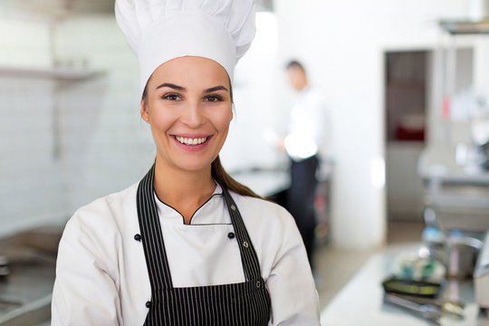 Female Chef In Kitchen
